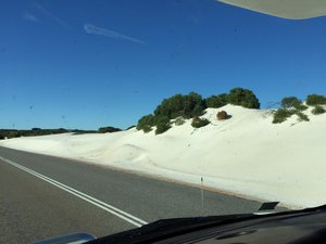 Sand dunes over the road