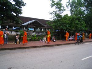 Monks recieving thier food for the day