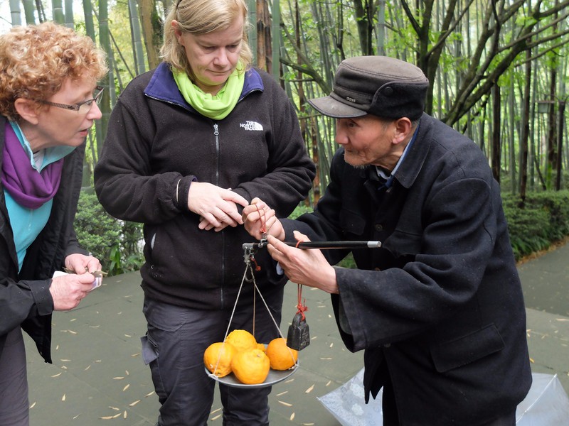Old man selling oranges