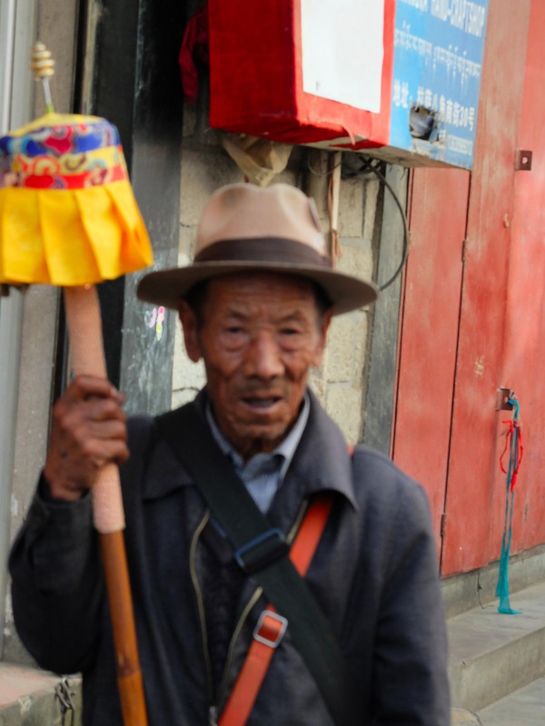 One of the many Tibetans with their prayer wheels