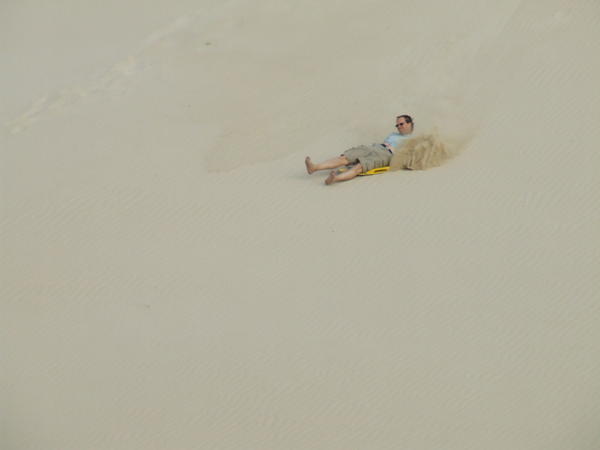 Sand surfing