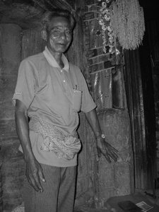 man and very old lingum at center of temple complex