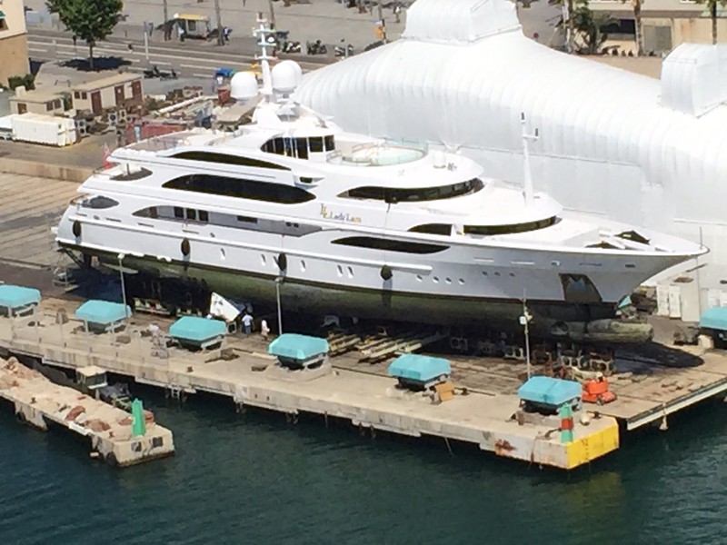 Super yacht in dry dock with brand  new one in plastic behind it