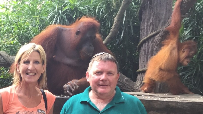 Michelle with the orangutan in the green shirt