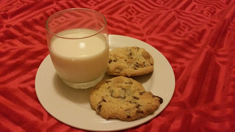 Homemade GF chocolate and nut cookies with milk.