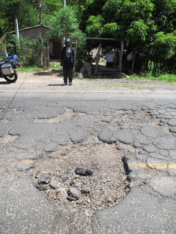 Giant potholes on the road towards the Nicaraguan border - that's my glove in the middle...