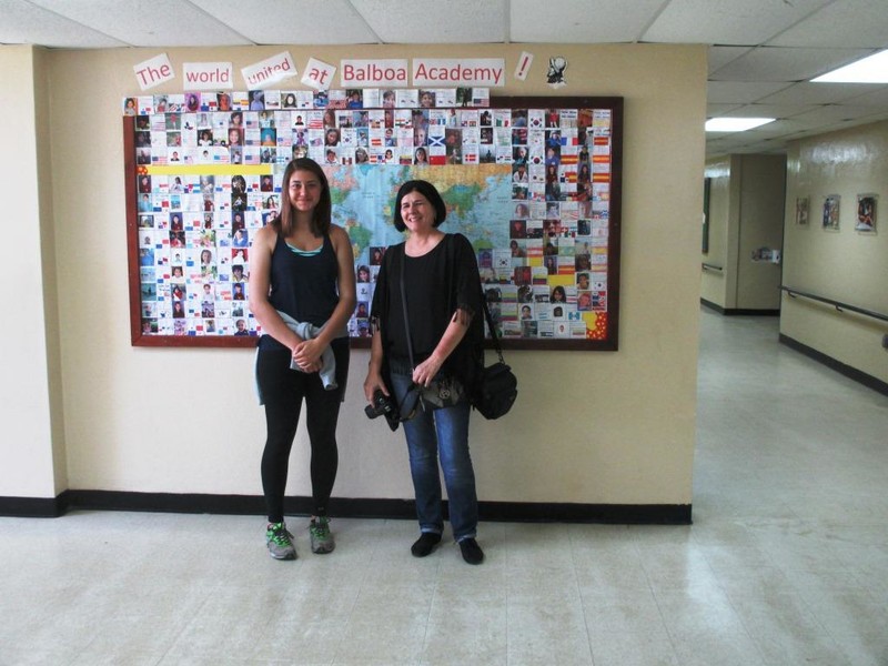 Zoe & Mrs. Kim in front of a student origin map