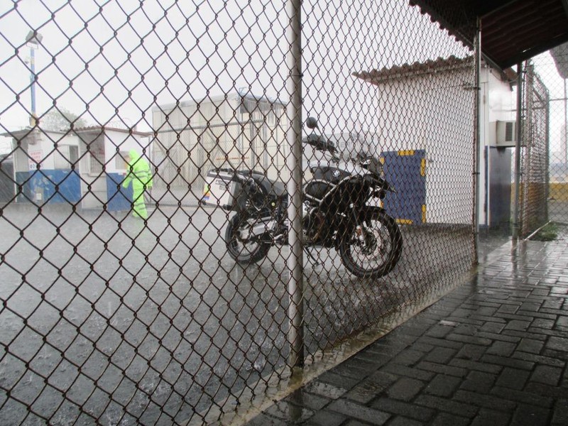 Waiting for the special motorcycle inspection in pouring rain