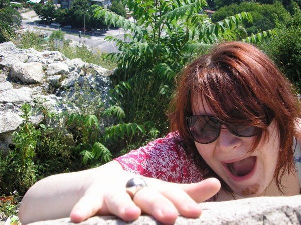 Tori pretending to fall of a rock