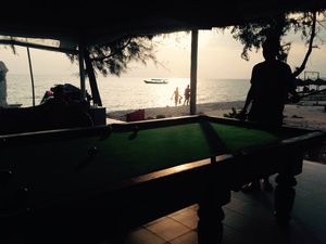 Playing pool at sunset