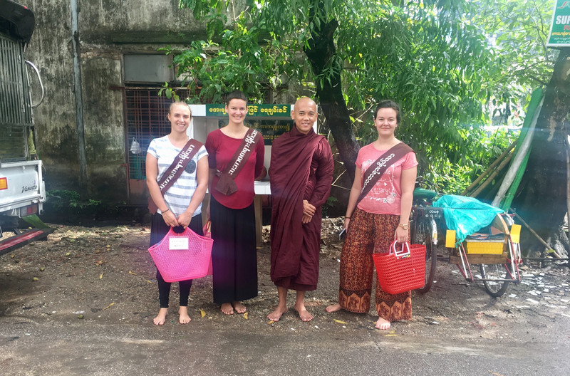 Monks and volunteers collecting daily Alms