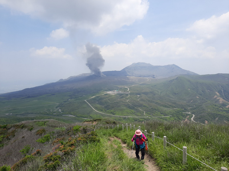 On Mount Aso with Nakadake crater erupting in the background