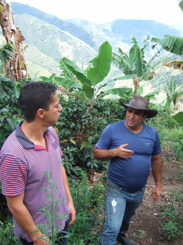 My host talking to coffee farmer