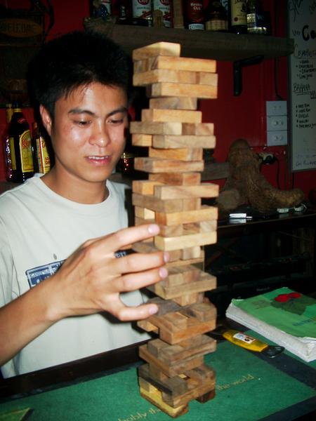 Jenga in a bar called "1/2 man, 1/2 noodle"