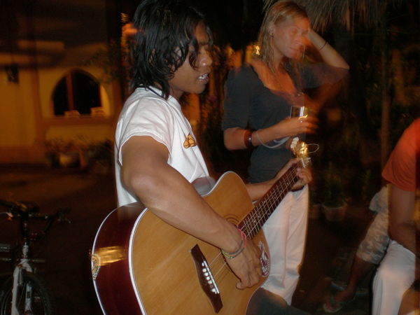 Gili local playing guitar