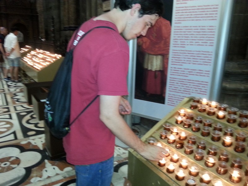 Andrew lighting a candle for Whitney