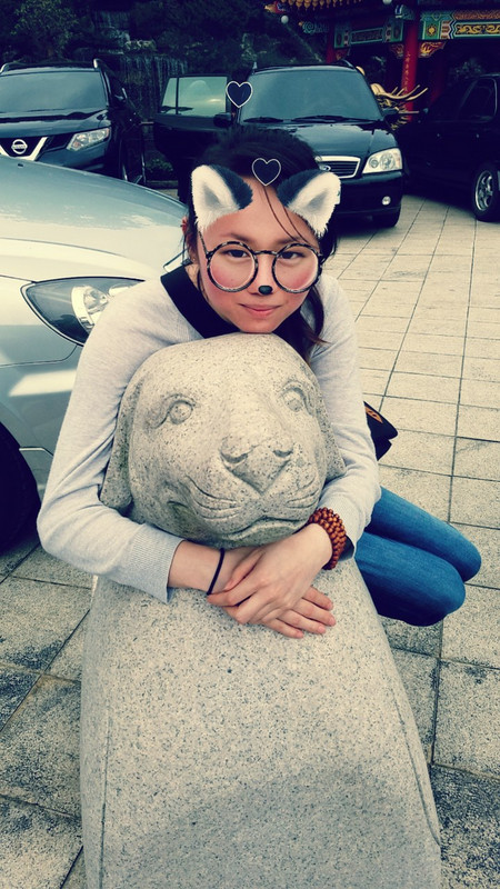 Tanya looking cute on the Year of the Dog statue