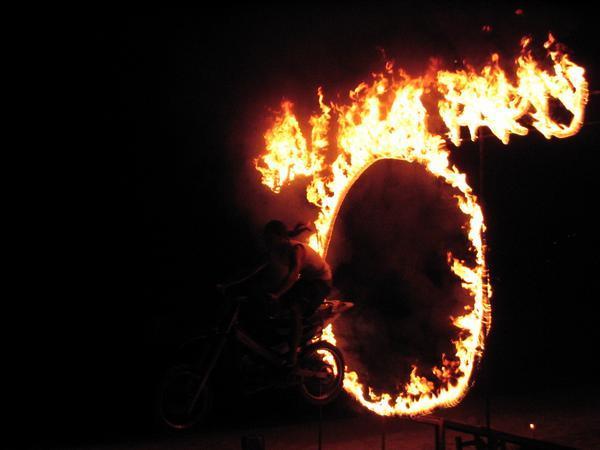 Motorbikes jumping thru rings of fire... 