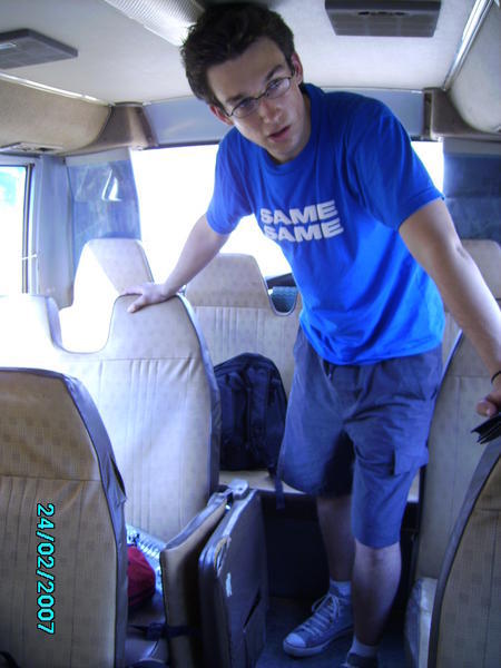 Cambodian bus beautifully demonstrates the lack of space by one of the tallest guy in the country?!Probably, 