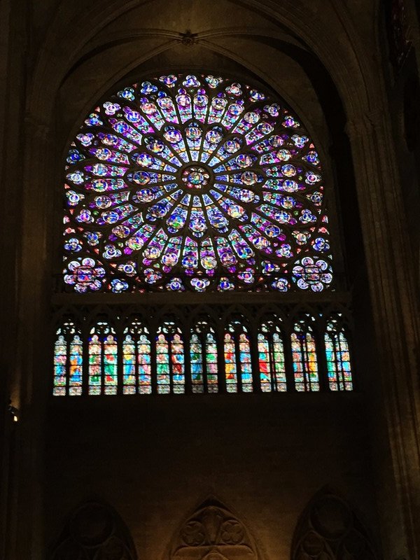 Detailed stained glass in Notre Dame