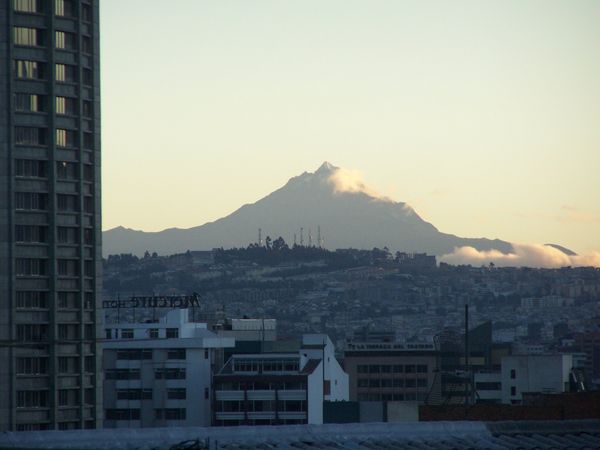 Distant mountains and highrise at sunrise