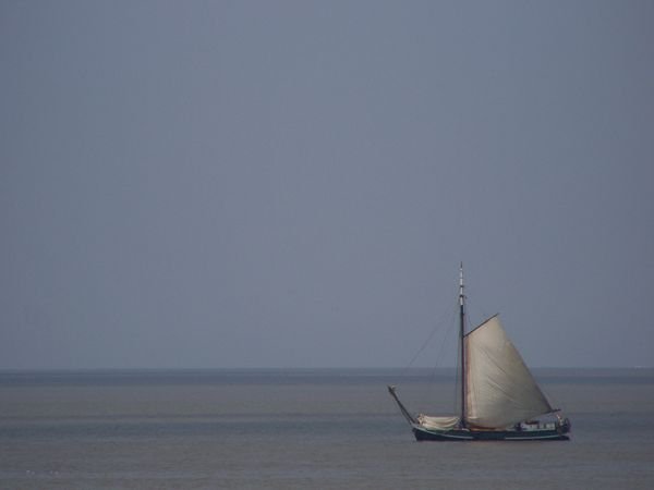 Sailing boat at the dyke