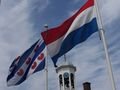 Frysland and Dutch flags flying in tandem