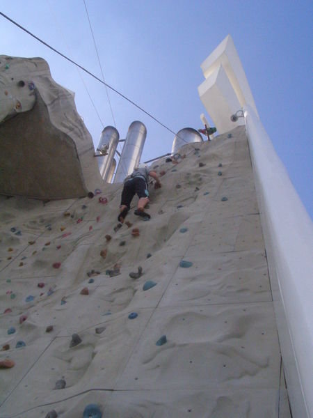 Kristi just about at the top of the rock wall