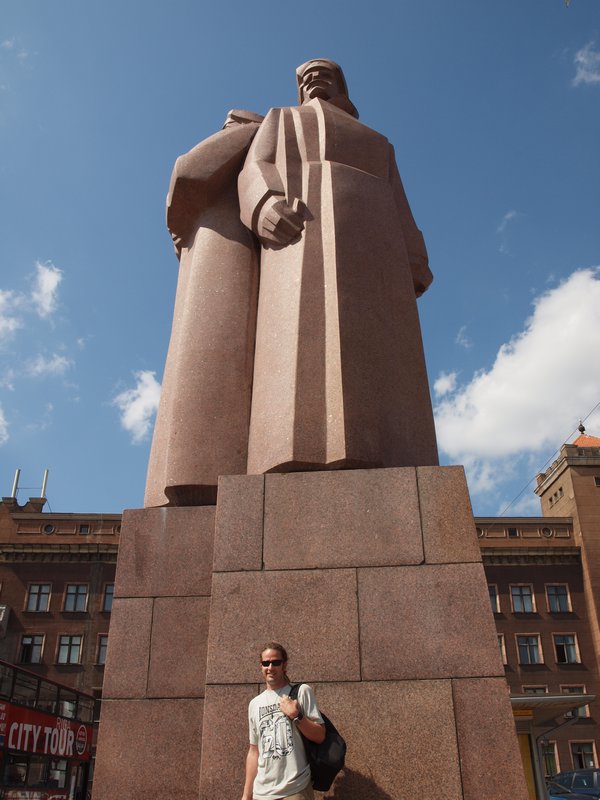 Martin with a statue dedicated to Latvian riflemen