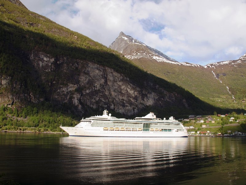 Cruise ship lit up up in the Geiranger Fjord