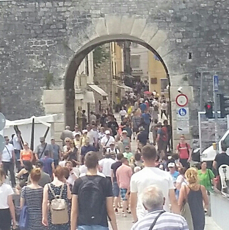 The Crowds walking into Old Town Gates that lead from the foot bridge.