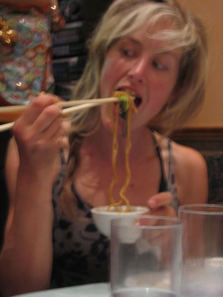Heather eyeing the noodles