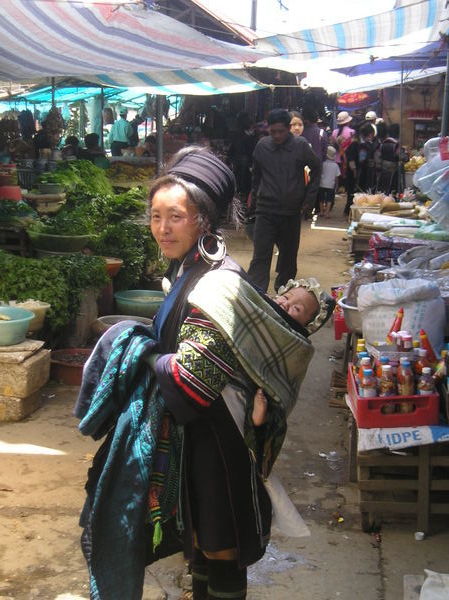Black Hmong woman with her baby
