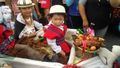 Cute kids with a basket of roasted guinea pigs!