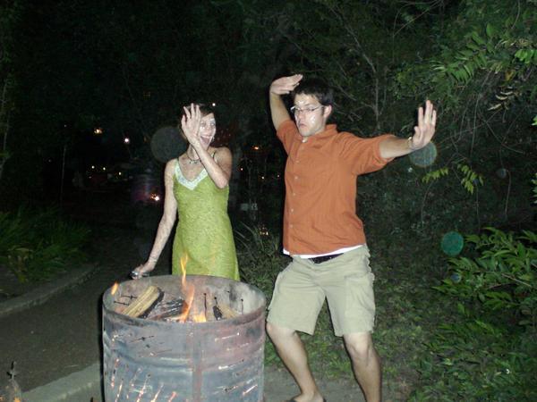 Rebekah and matt dancing around the Fire
