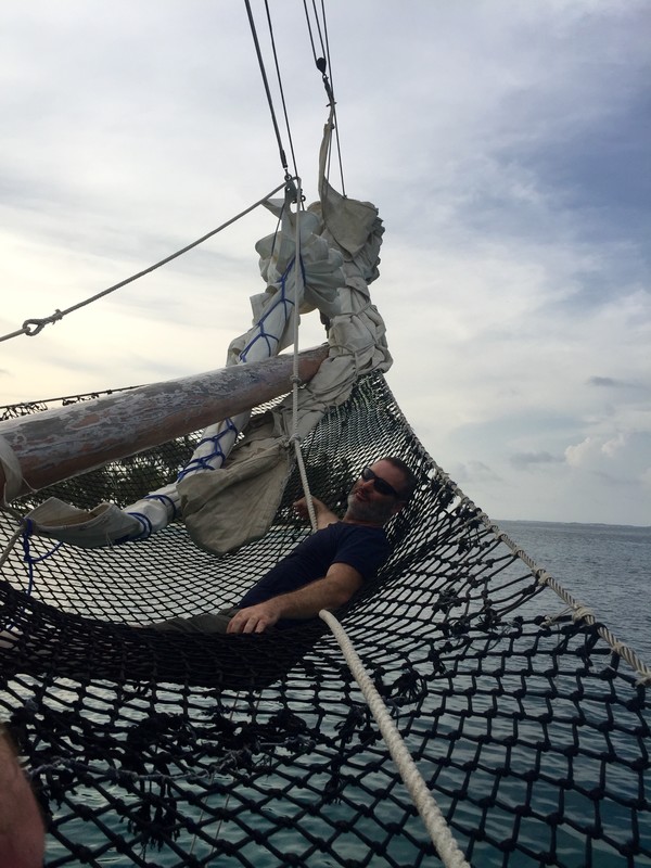 Trev resting in the net by the bowsprit 