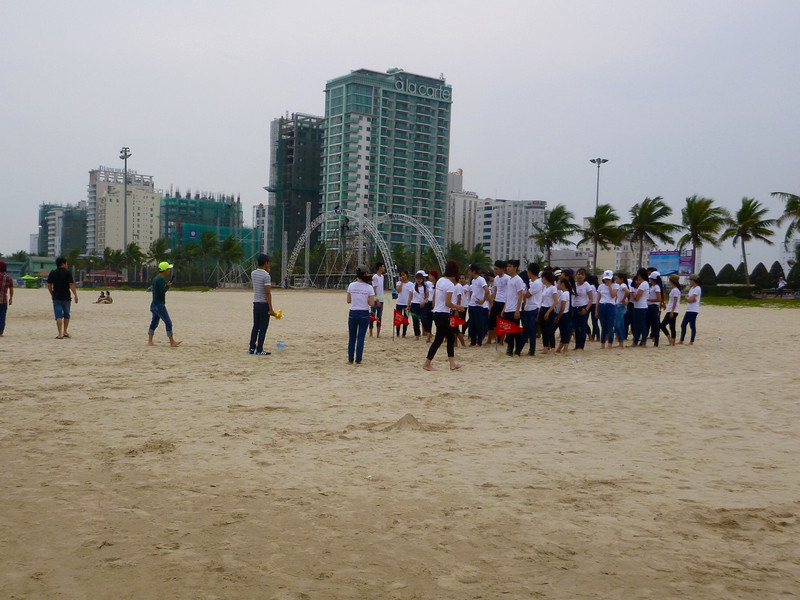 Organized school group playing games at the beach