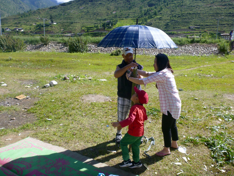 Tshering and his wife setting up a bit of shade 