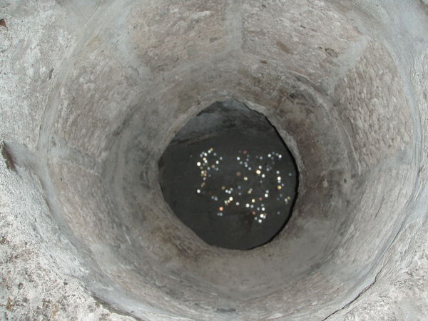 Peering into an old well