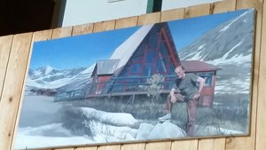 Painting of Hap outside Hatcher's Pass Lodge