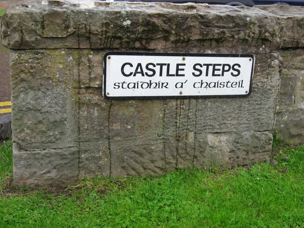 The street signs are in English and Gaelic