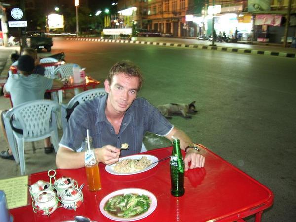 A sight I thought I would never see - Rob dines out street style with stray dogs waiting for the left overs !