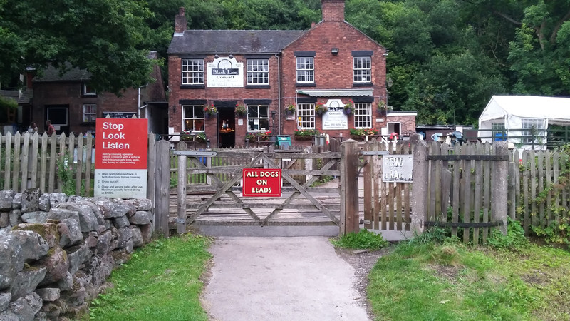 The Black Lion pub and railway crossing
