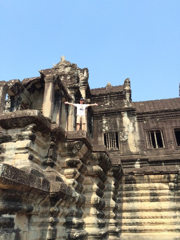 Standing on the ancient ruins of Angkor Wat