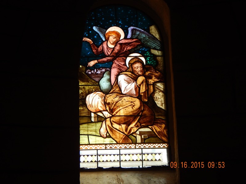Stainglass of angel appearing to Joseph in a dream