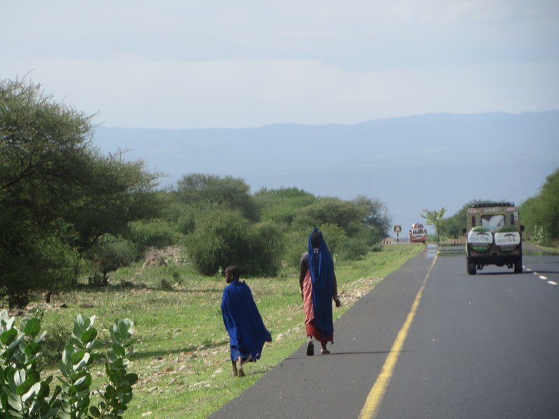 first glimpse of a masai walkin down the road