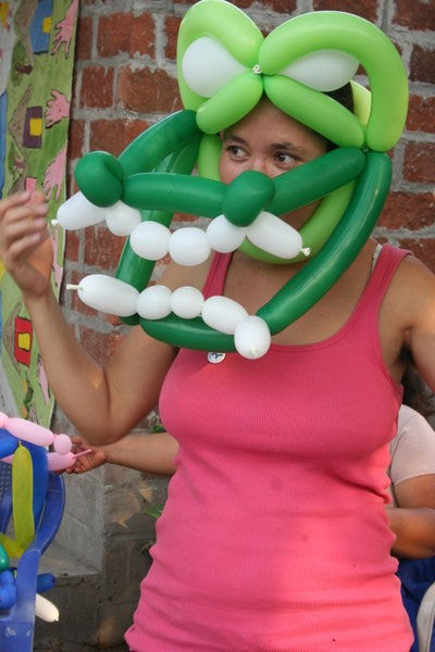 Tania with her crocodile mask from the balloon-twisting workshop
