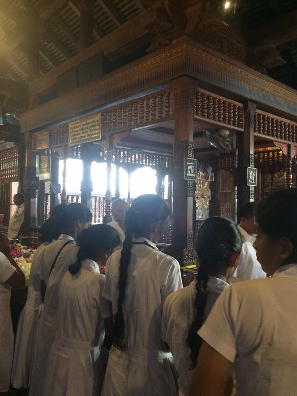 School pupils saying a prayer