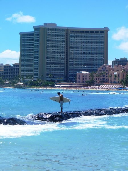 Surfer and hotel