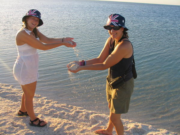 Jessica and Dafne play with some shells